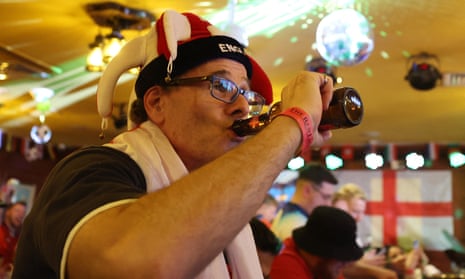 England fan drinks beer in a pub