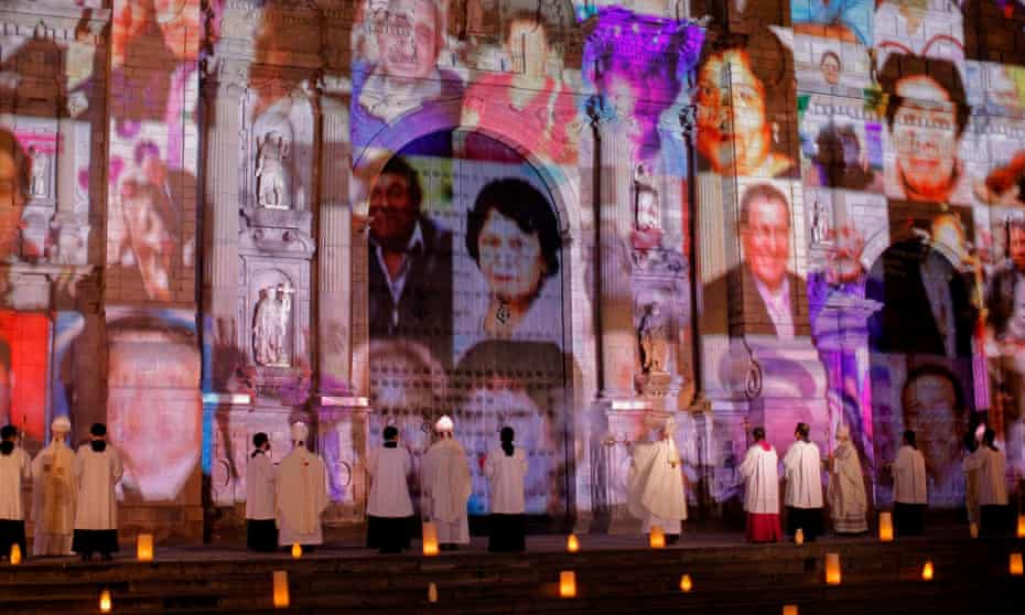 Pictures of Covid-19 victims projected on the Lima cathedral during a candlelight open-air mass in November 2020.