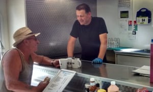 Carlsburger’s Carl Johnson with a customer.