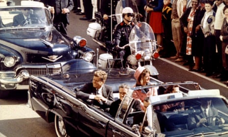 President Kennedy and the first lady ride through Dallas moments before the president was shot by Lee Harvey Oswald, 22 November, 1963.