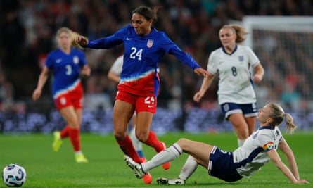 Leah Williamson of England tackles Yazmeen Ryan of United States during the Women’s international friendly between England and the USA at Wembley Stadium on November 30, 2024 in London, England.