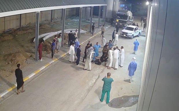 A 2020 CCTV image shows Tarik al-Sheibani, an Iraqi doctor and director of Al-Amal hospital, in Najaf, Iraq, being beaten by relatives of a patient who died of Covid.