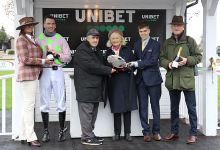 Willie Mullins (right), his mother Maureen (centre right) and son Patrick (second left) collect the trophy after winning the Morgiana Hurdle with Sharjah at Punchestown in County Kildare in 2021