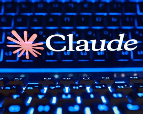 A pink Claude logo and white text glow above an illuminated blue keyboard