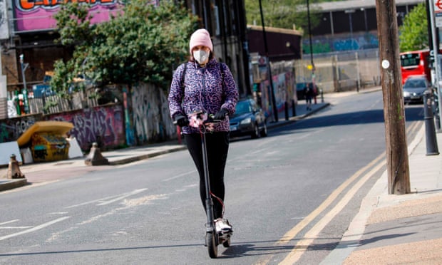 woman on e-scooter in London