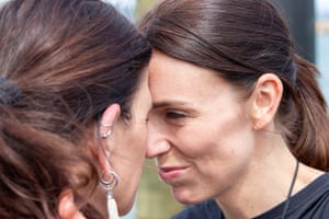 Ardern greets a member of the outrigger canoe crew