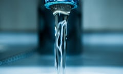 Water coming out of a tap<br>concept of water saving and sustainable development