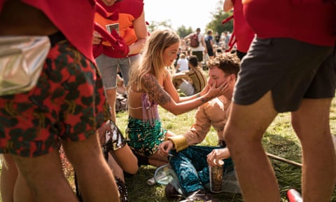 Festival-goers enjoy the fine weather on the third day of the Glastonbury Festival