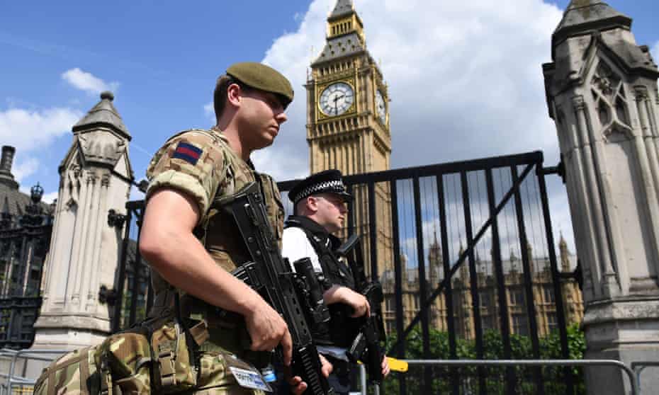 British army soldiers patrol along Whitehall.