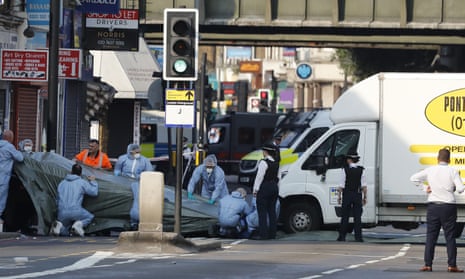 Forensic officers examine the van driven by Darren Osborne that killed Makram Ali outside Finsbury Park mosque in 2017. 