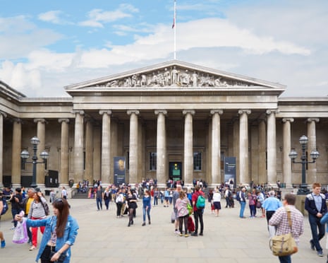 Exterior of Great Russell Street entrance of British Museum with people in courtyard