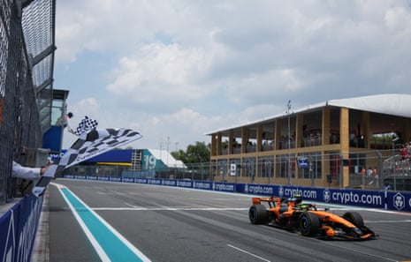McLaren's Lando Norris crosses the line to win the sprint race.