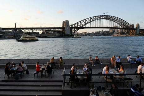 Patrons dine-in at a bar by the harbour in the wake of coronavirus regulations easing, following an extended lockdown to curb an outbreak, in Sydney, Australia, on 22 October, 2021.