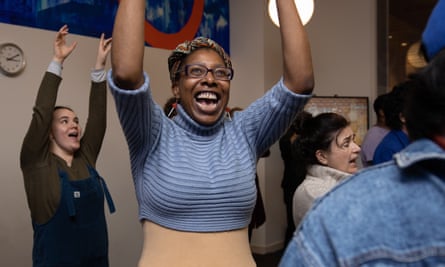 Phillippa Marlowe-Hunt laughing with arms raised.