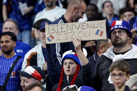 Fans of France cheer.