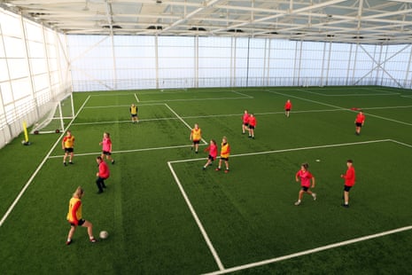 The Foundation of Light girls scholar’s training as part of the scholarship programme on the covered pitch at the top of the Beacon of Light.