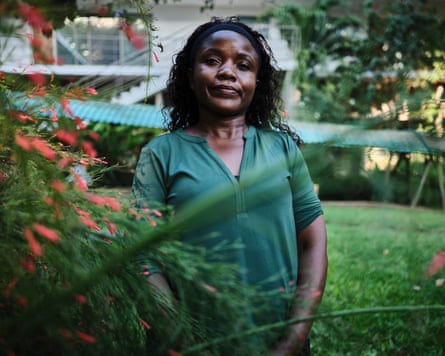 An African female posing successful a plot