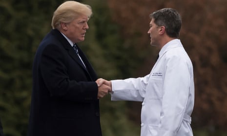 Donald Trump shakes hands with Dr Ronny Jackson.