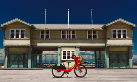 A Lime e-bike outside a beachside bather’s pavilion