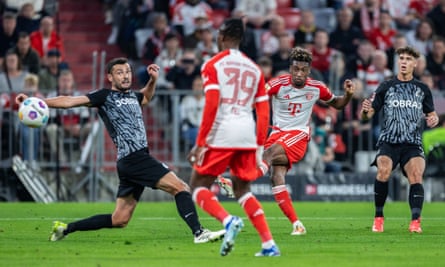 Kingsley Coman scores Bayern Munich’s third goal against Freiburg.