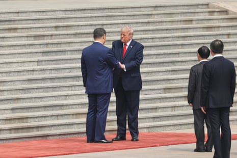 Xi Jinping greets Donald Trump during a welcome ceremony at the Great Hall of the People.