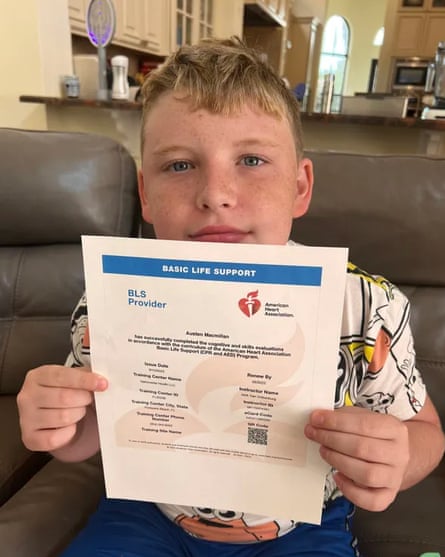 Austen Macmillan holds up his American Heart Association Basic Life Support certificate in September 2023.