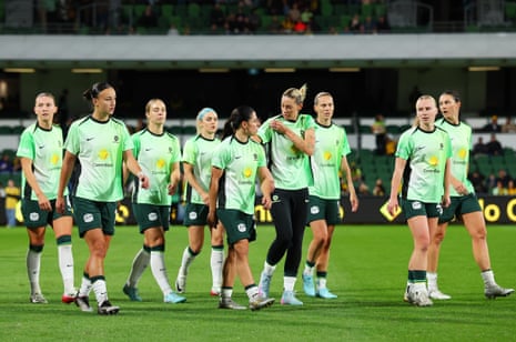 The Matildas walk off the pitch after warm up.