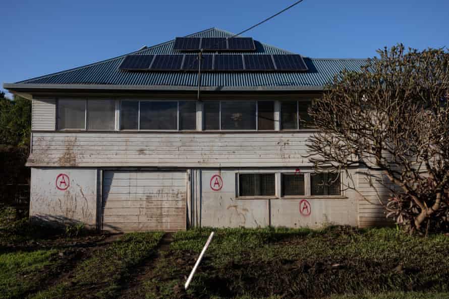 A flood affected property, marked to be containing asbestos, in South Lismore.