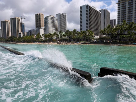 Waves slam into a sea wall off Waikiki Beach in Honolulu, Hawaii on Wednesday after authorities downgraded earlier tsunami warnings following an earthquake off Russia’s Far Eastern Kamchatka Peninsula.