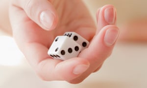 Woman holding pair of dice