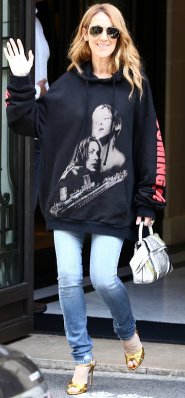 Celine Dion July 09, 2016 Singer Celine Dion, sporting a sweater with Leonardo DiCaprio and Kate Winslet in the film 'Titanic' on it, waves to her fans as she leaves the Royal Monceau palace hotel in Paris, France.
