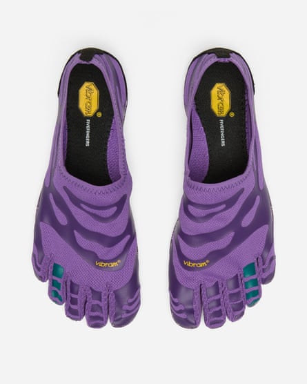 A pair of purple five-toed shoes with black soles and Vibram logo insoles, viewed from above