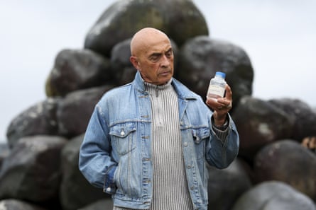 Ray Ahipene-Mercer with a bottle of treated water.