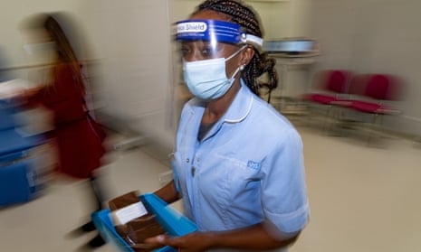 A nurse prepares to administer Covid vaccines at Croydon University hospital in London in December 2020