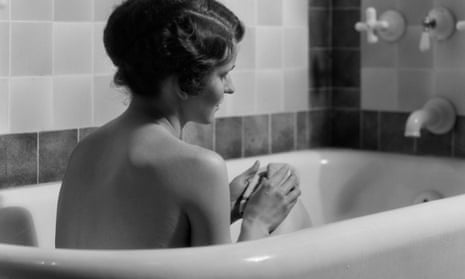 1920s 1930s woman sitting in bath tub13 Oct 1930 --- 1920s 1930s woman sitting in bath tub --- Image by © ClassicStock/Corbis