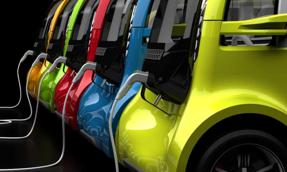 A row of electric cars being charged