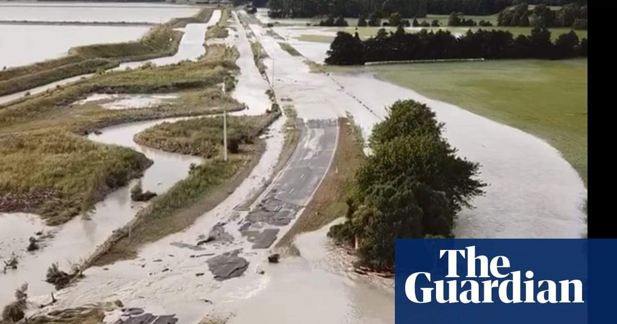 New Zealand storms: tornado warning issued as floods cut off towns