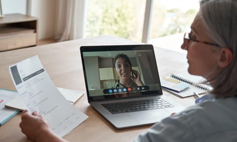 Employer reading CV during online job interview by video call
