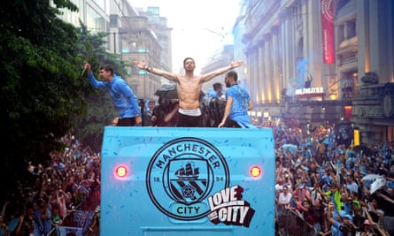 Jack Grealish of Manchester City celebrates on the open-top bus during the club’s trophy parade on in June 2023.