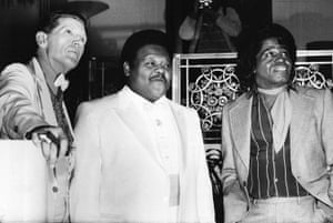 Jerry Lee Lewis, Fats Domino and James Brown at a reception where they were inducted into the Rock and Roll Hall of Fame at the Waldorf-Astoria Hotel in New York, 1986