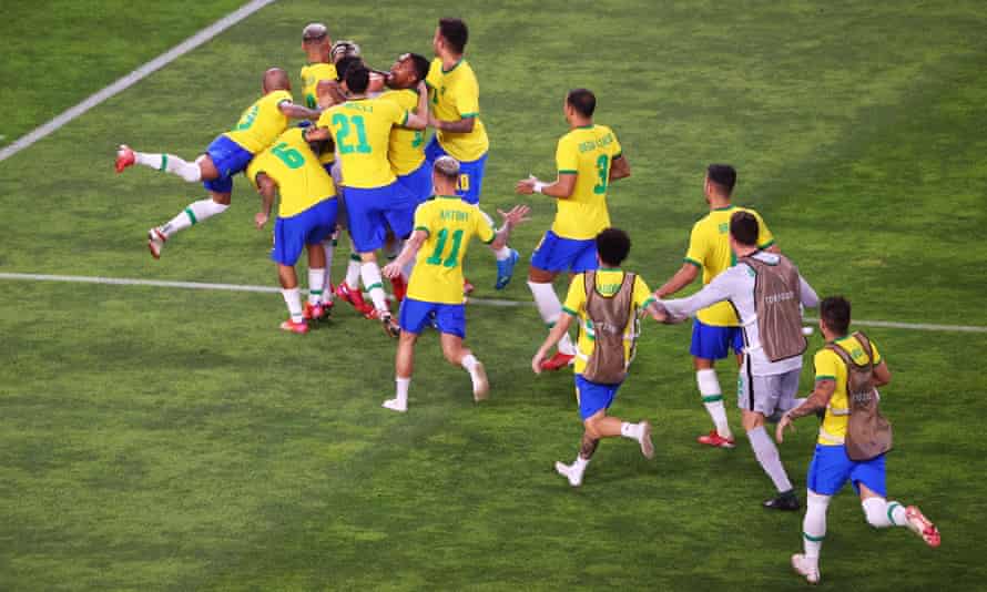 Brazil celebrate after Reinier’s decisive penalty in the shootout with Mexico.