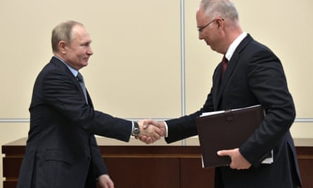 Kirill Dmitriev (right) shaking hands with the Russian president, Vladimir Putin, in January.