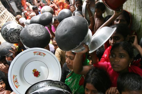 Women and children gather for food in Bangladesh