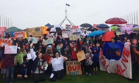 Students striking from school on Wednesday protest climate inaction at Parliament House, Canberra.