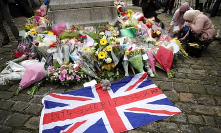 People leave floral tributes to Cox in Market Square.