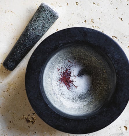 Use a mortar and pestle to grind the saffron threads with the sugar.
