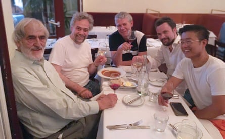 Helmut-Lachenmann, left, with the members of Quatuor Diotima sitting at a meal around a table.