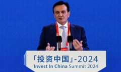 Pascal Soriot speaking at a podium bearing the sign 'Invest in China Summit 2024'