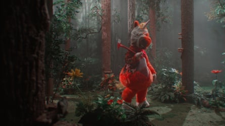 a person in a red unicorn costume holding an axe in a forest scenery
