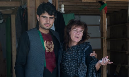 Volunteer Liz Clegg and a young man in the Calais refugee camp.